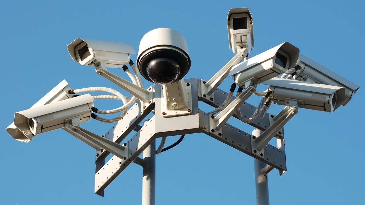 A tower of multiple surveillance cameras.